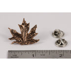 A handcrafted Maple Leaf Pin next to a ruler, available for sale at Creativeartisan.com - the image offers a sense of scale