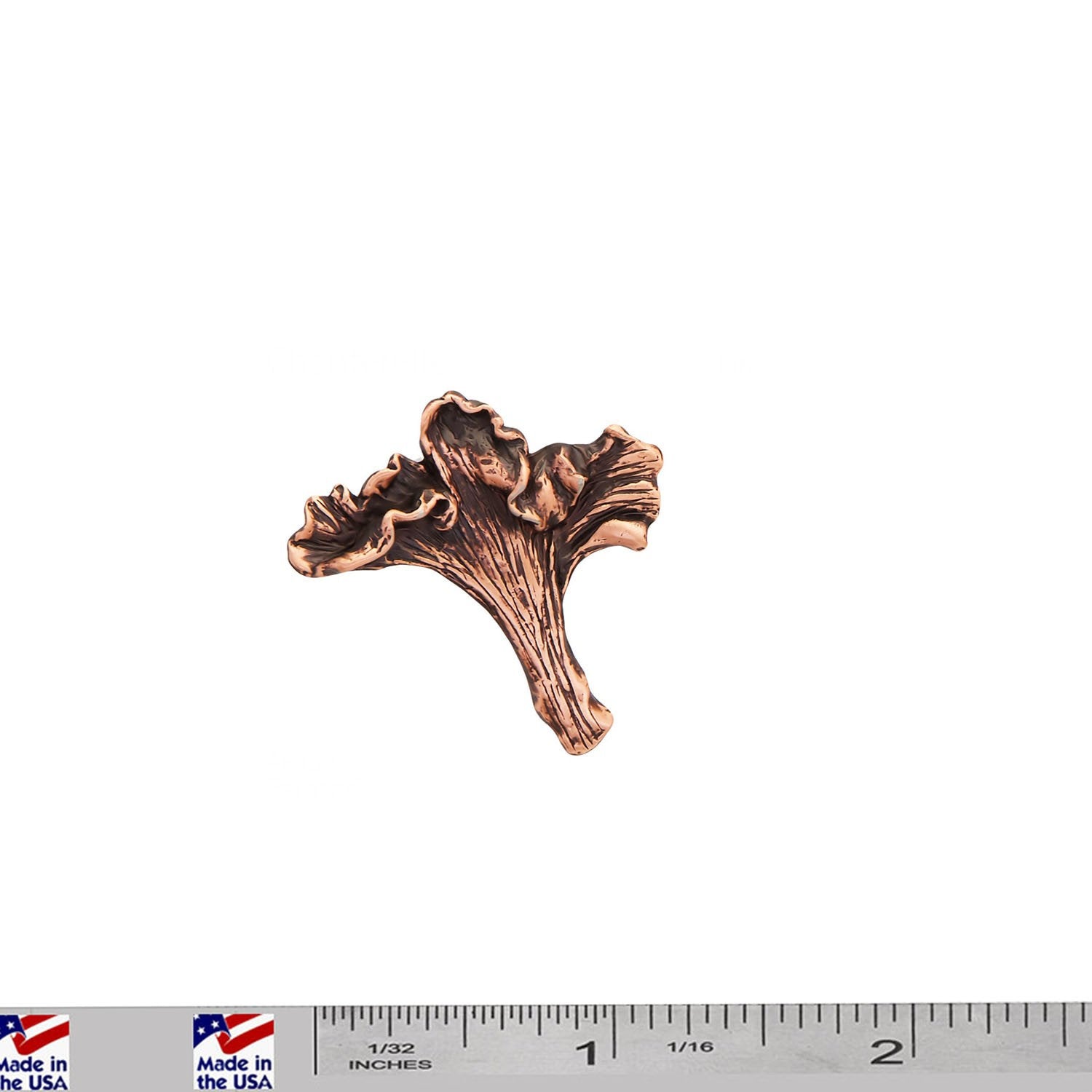 A handcrafted Chanterelle Mushroom Pin next to a ruler, available for sale at Creativeartisan.com - the image offers a sense of scale
