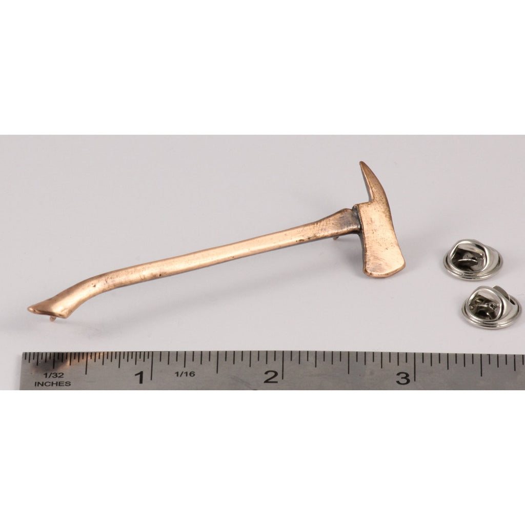 A handcrafted Firemans Axe Pin next to a ruler, available for sale at Creativeartisan.com - the image offers a sense of scale