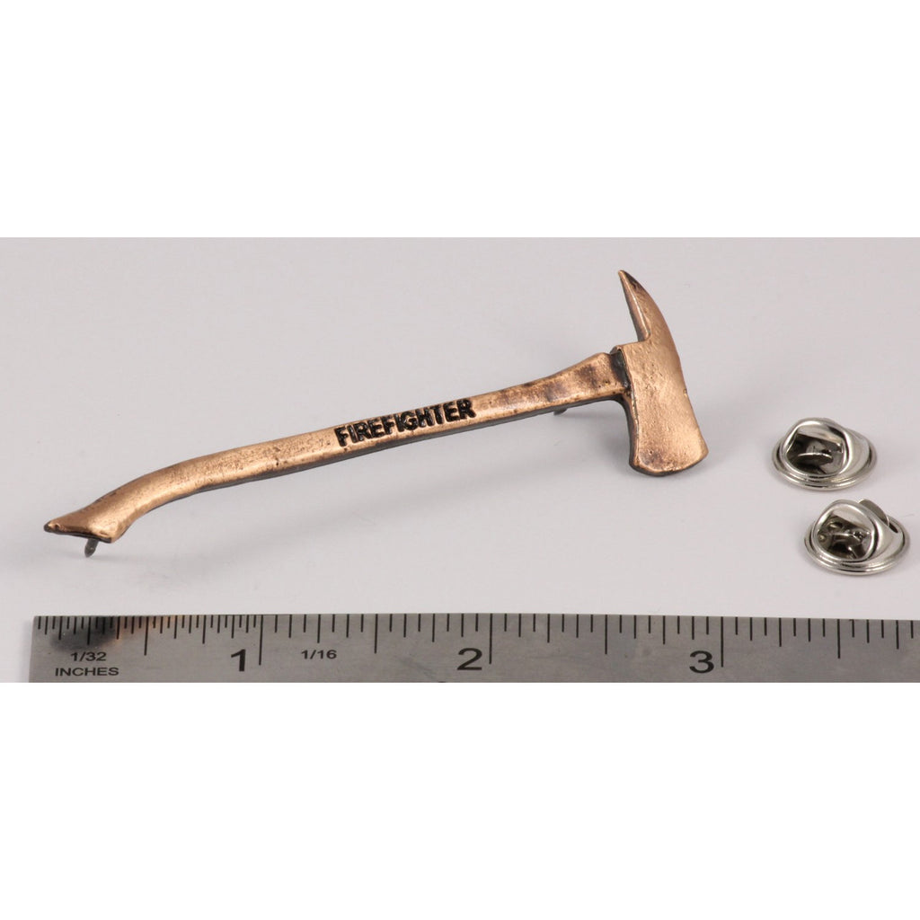 A handcrafted Firemans Axe Firefighter Engraved Pin next to a ruler, available for sale at Creativeartisan.com - the image offers a sense of scale