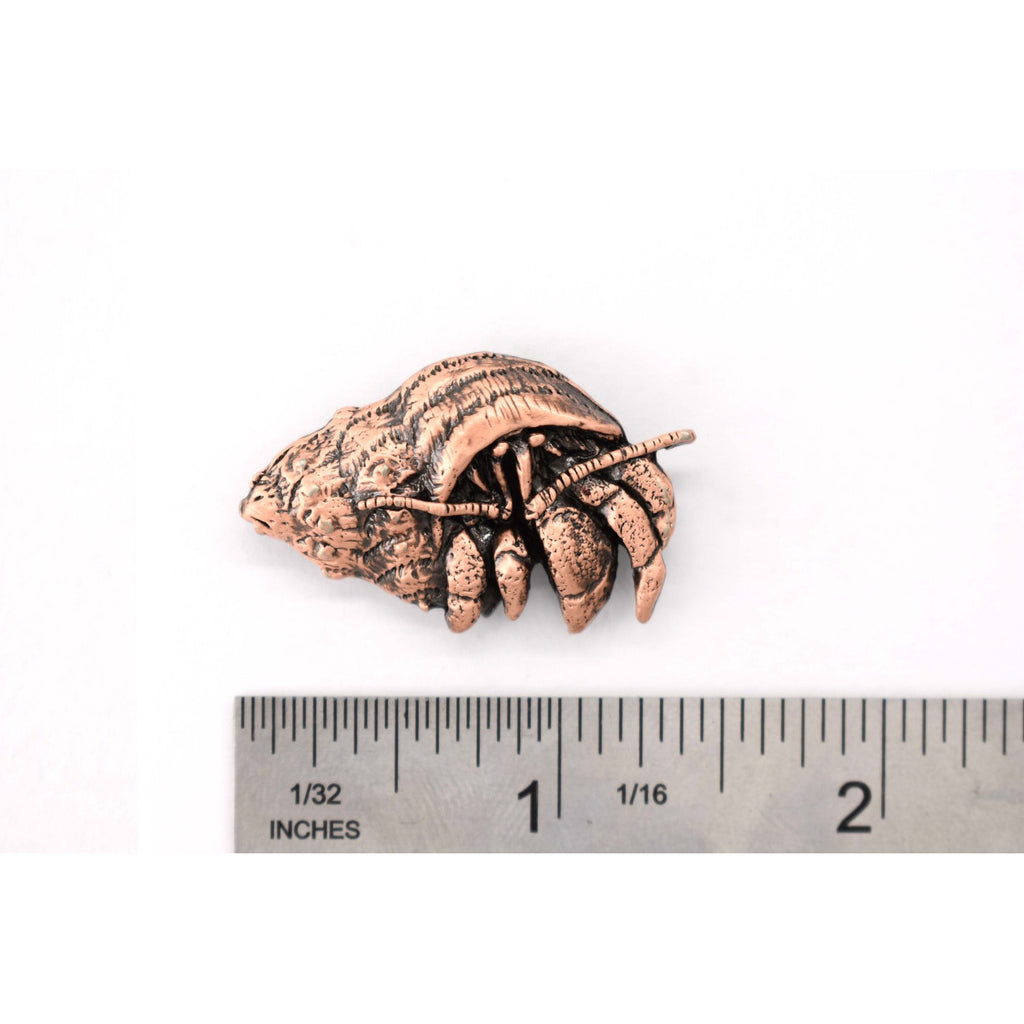 A handcrafted Hermit Crab Pin next to a ruler, available for sale at Creativeartisan.com - the image offers a sense of scale