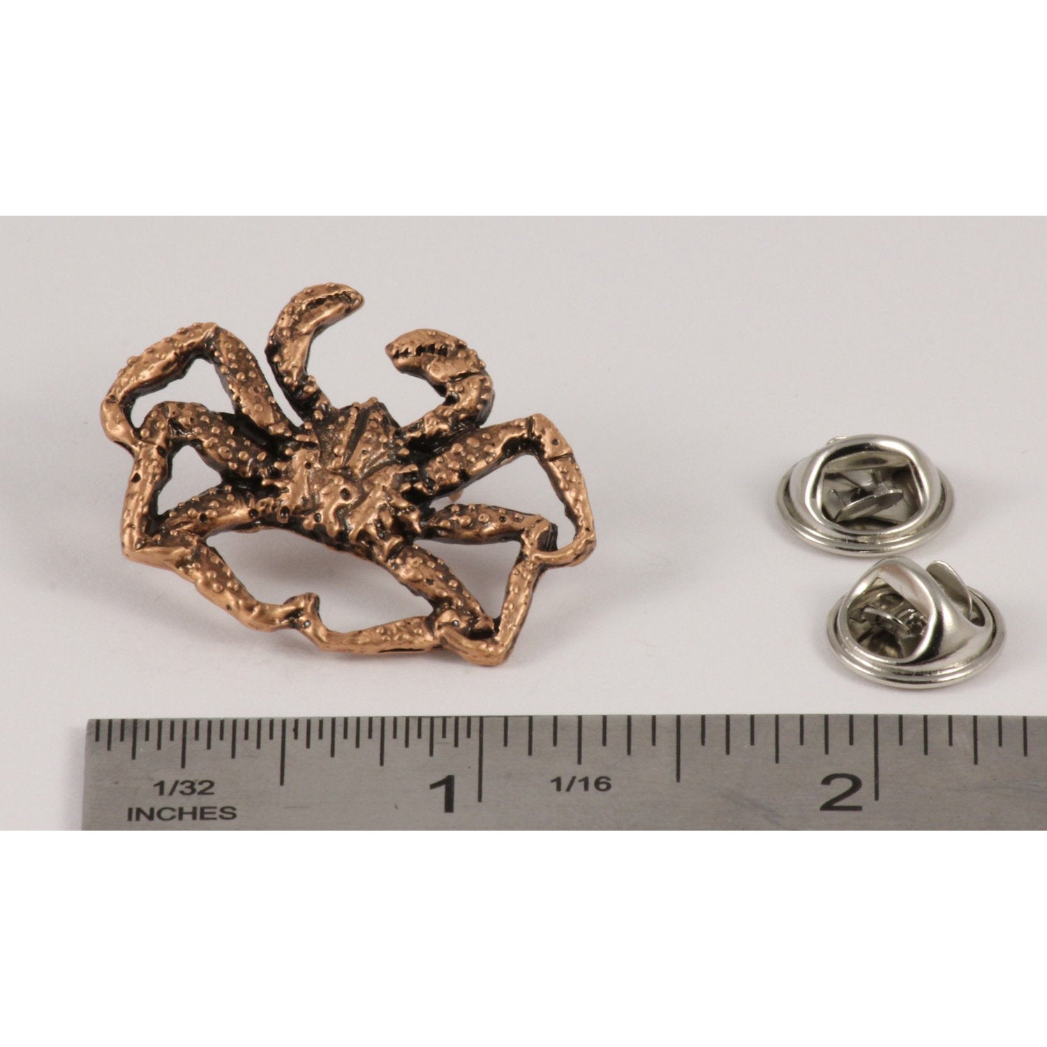 A handcrafted King Salmon Alaska Pin next to a ruler, available for sale at Creativeartisan.com - the image offers a sense of scale