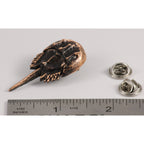 A handcrafted Horseshoe Crab Pin next to a ruler, available for sale at Creativeartisan.com - the image offers a sense of scale