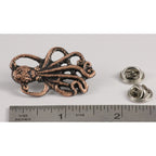 A handcrafted Octopus Pin next to a ruler, available for sale at Creativeartisan.com - the image offers a sense of scale