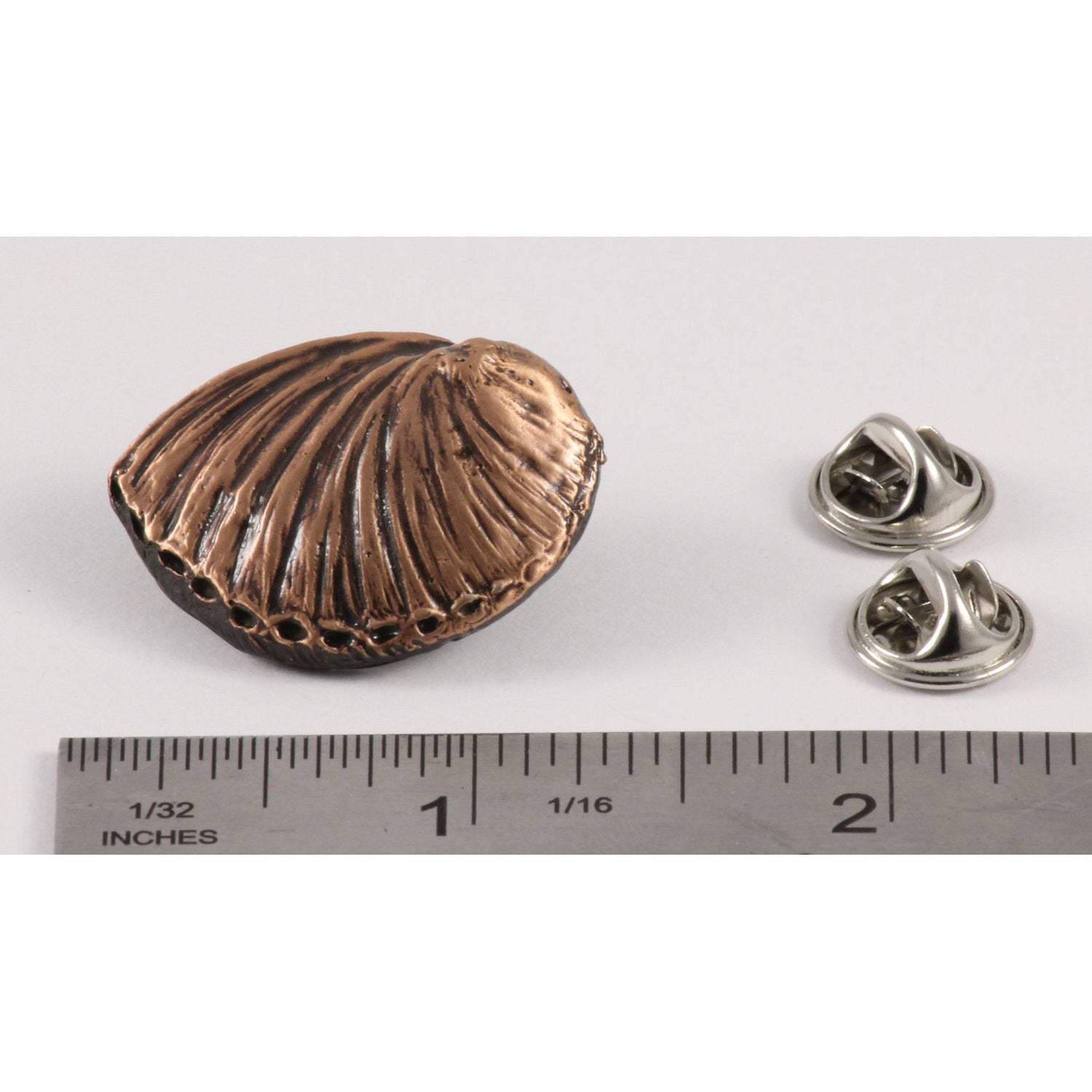 A handcrafted Abalone Shell Pin next to a ruler, available for sale at Creativeartisan.com - the image offers a sense of scale
