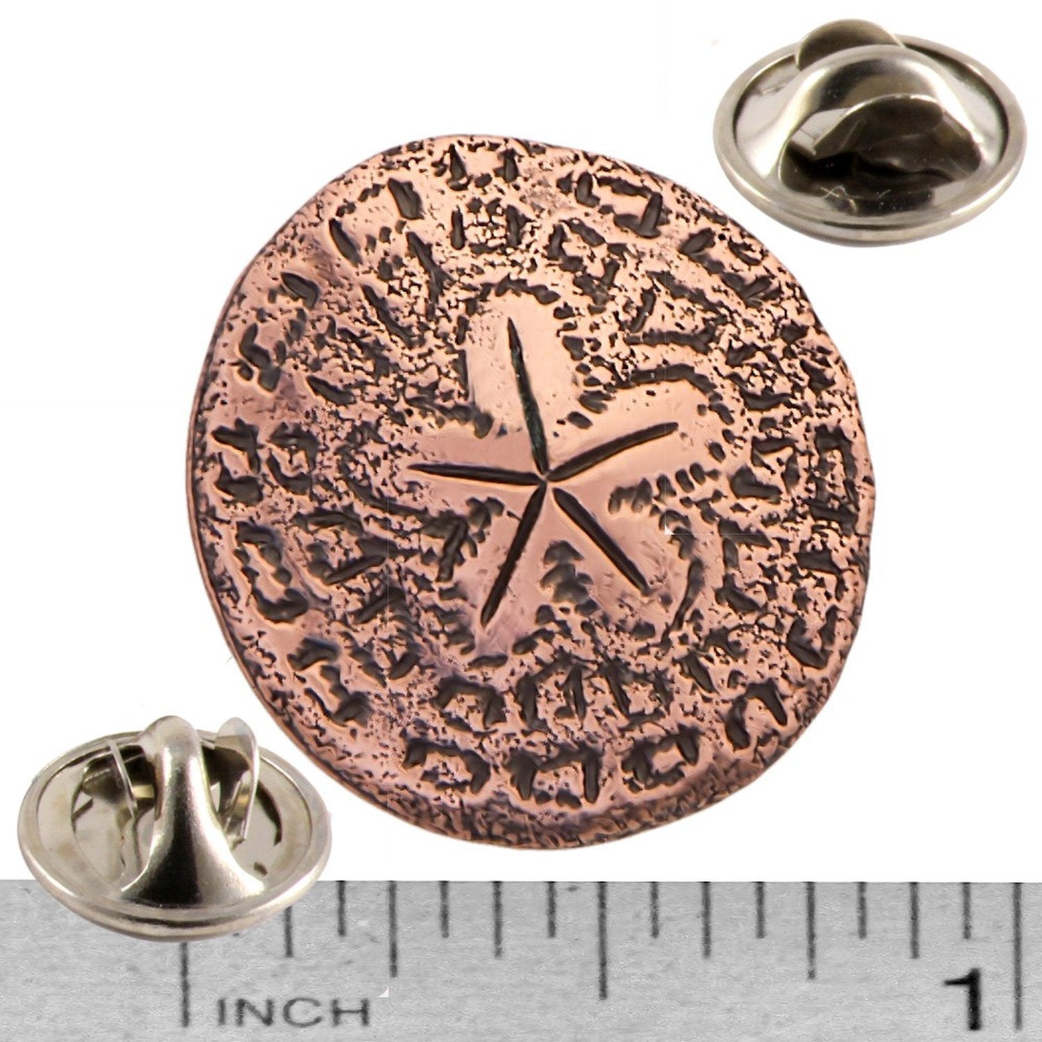 A handcrafted Sand Dollar Pin next to a ruler, available for sale at Creativeartisan.com - the image offers a sense of scale