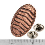 A handcrafted Chiton Pin next to a ruler, available for sale at Creativeartisan.com - the image offers a sense of scale