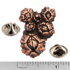A handcrafted Barnacles Cluster Pin next to a ruler, available for sale at Creativeartisan.com - the image offers a sense of scale