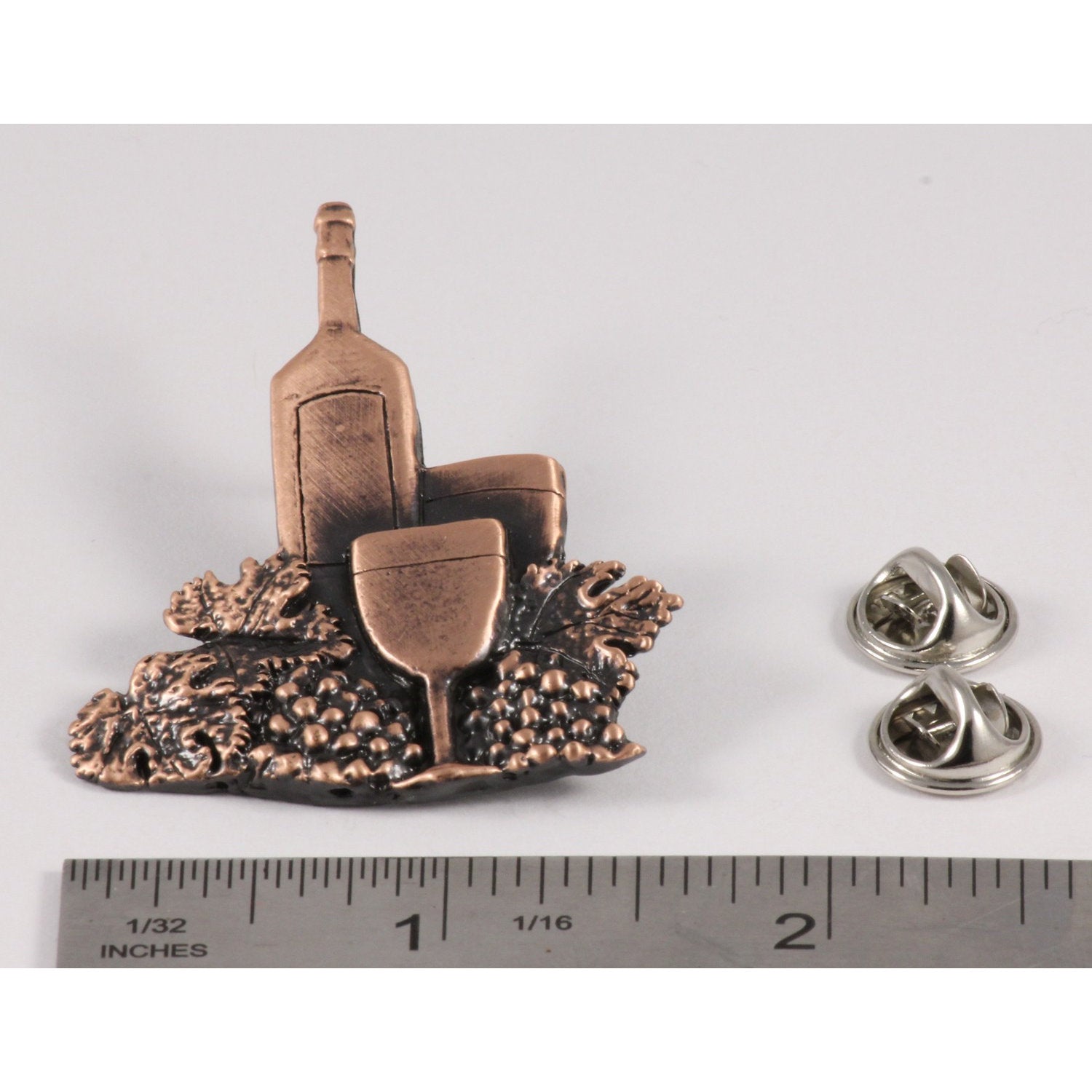 A handcrafted White Wine Bottle Glass Pin next to a ruler, available for sale at Creativeartisan.com - the image offers a sense of scale