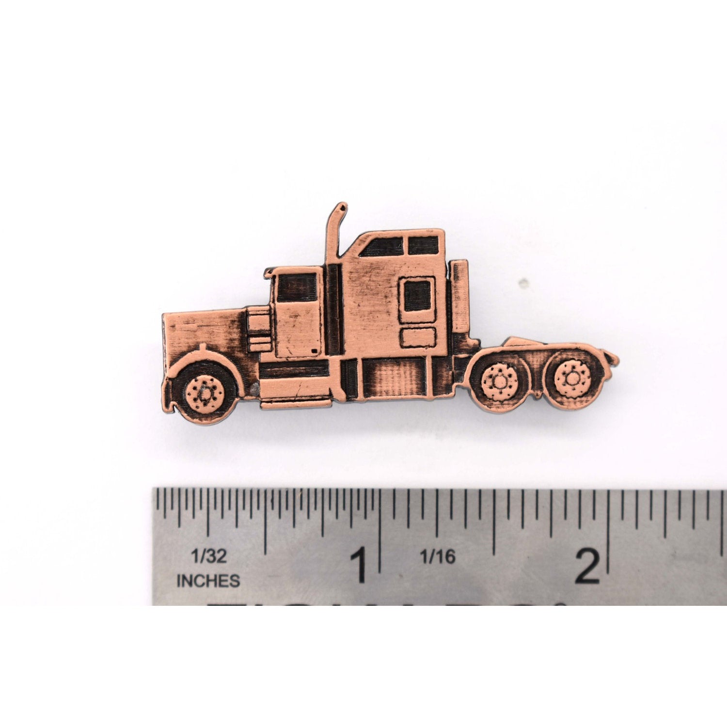 A handcrafted Semi Truck Pin next to a ruler, available for sale at Creativeartisan.com - the image offers a sense of scale