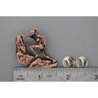 A handcrafted Rock Climber Female Pin next to a ruler, available for sale at Creativeartisan.com - the image offers a sense of scale