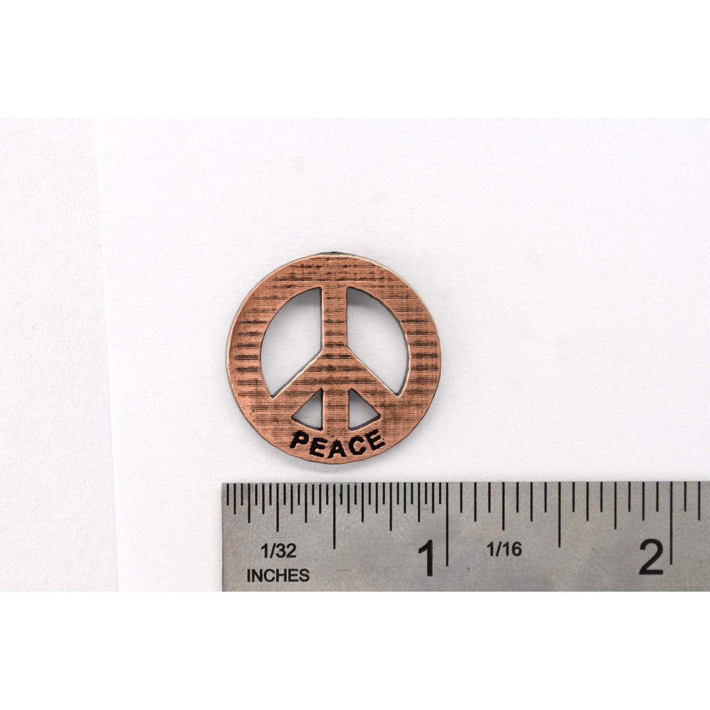 A handcrafted Peace Imprinted With Peace Pin next to a ruler, available for sale at Creativeartisan.com - the image offers a sense of scale