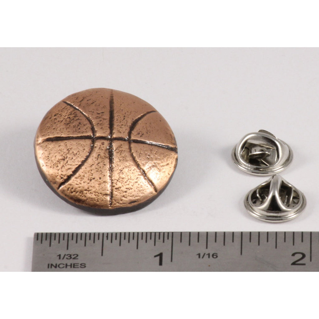 A handcrafted Basketball Pin next to a ruler, available for sale at Creativeartisan.com - the image offers a sense of scale