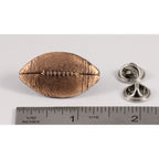 A handcrafted Football Pin next to a ruler, available for sale at Creativeartisan.com - the image offers a sense of scale