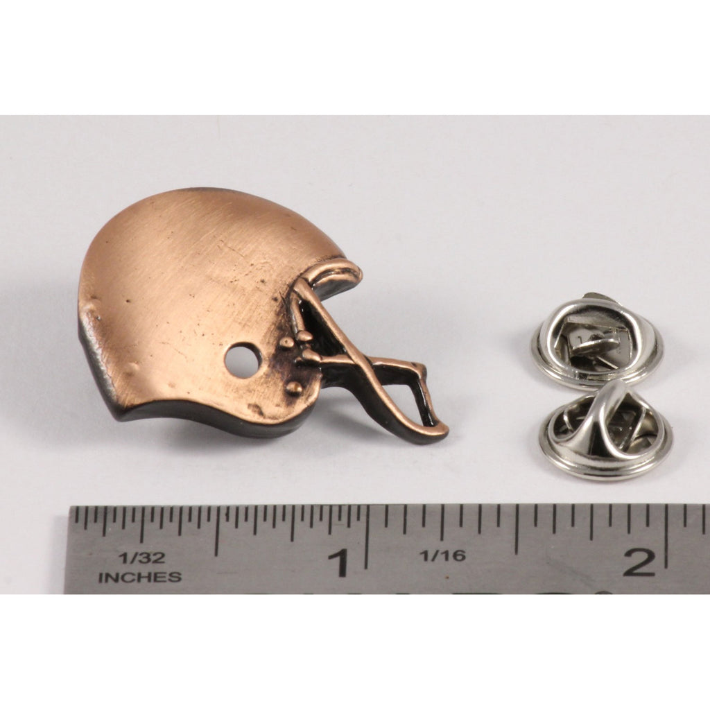A handcrafted Football Helmet Pin next to a ruler, available for sale at Creativeartisan.com - the image offers a sense of scale