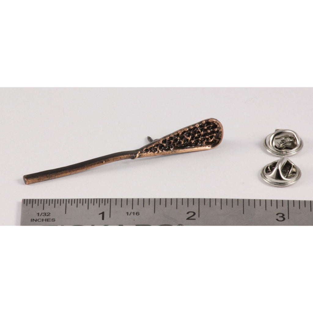 A handcrafted La Crosse Native Stick Pin next to a ruler, available for sale at Creativeartisan.com - the image offers a sense of scale