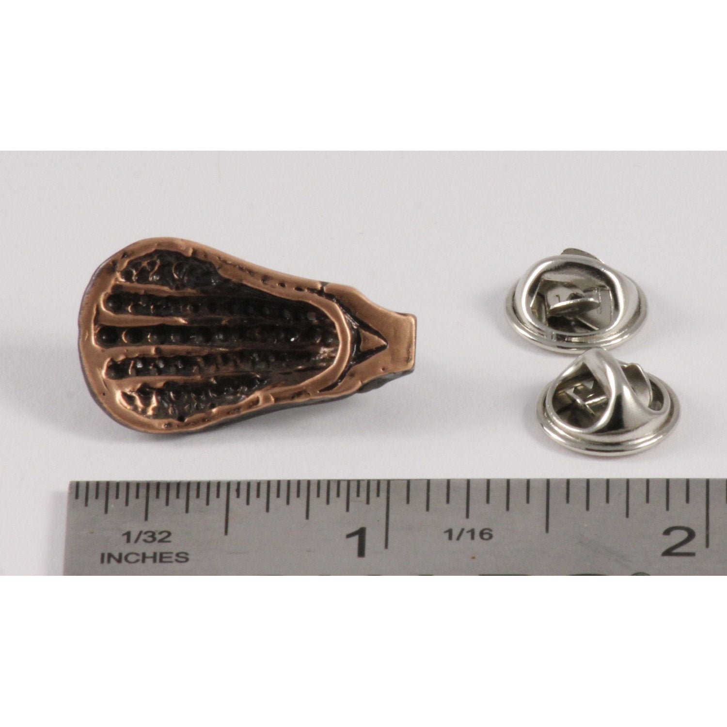 A handcrafted La Crosse Small Head Pin next to a ruler, available for sale at Creativeartisan.com - the image offers a sense of scale