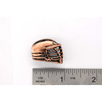 A handcrafted La Crosse Helmet Pin next to a ruler, available for sale at Creativeartisan.com - the image offers a sense of scale