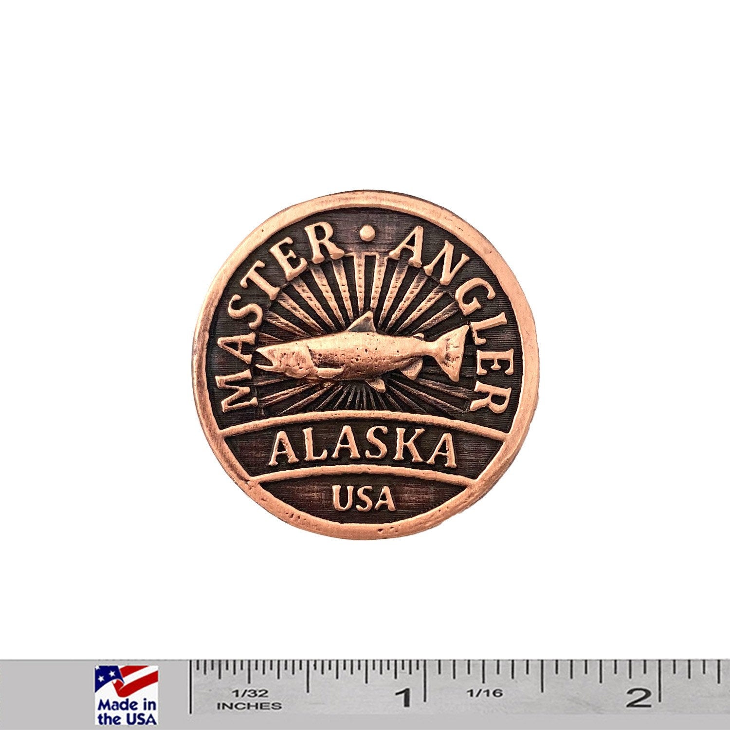 A handcrafted Alaska Master Angler Pin next to a ruler, available for sale at Creativeartisan.com - the image offers a sense of scale