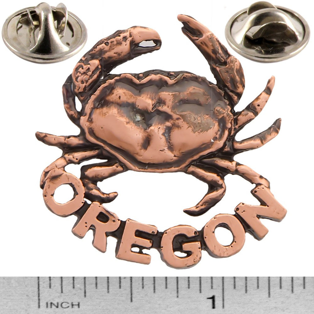 A handcrafted Dungeness Crab Oregon Pin next to a ruler, available for sale at Creativeartisan.com - the image offers a sense of scale