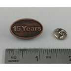 A handcrafted 15 Year Pin next to a ruler, available for sale at Creativeartisan.com - the image offers a sense of scale