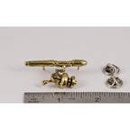 A handcrafted Spinning Rod Reel Pin next to a ruler, available for sale at Creativeartisan.com - the image offers a sense of scale