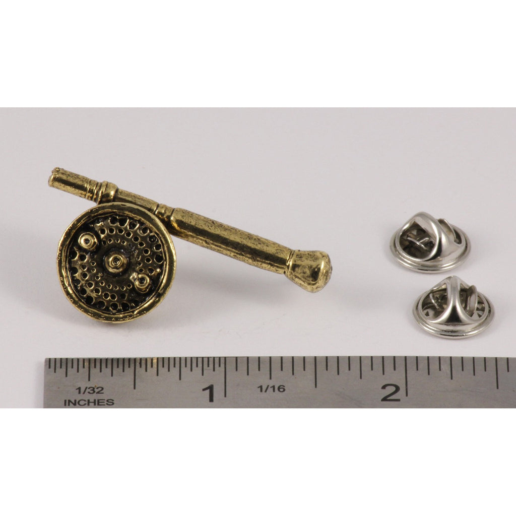 A handcrafted Saltwater Fly Rod Reel Pin next to a ruler, available for sale at Creativeartisan.com - the image offers a sense of scale