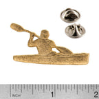 A handcrafted Kayaker With Paddle Pin next to a ruler, available for sale at Creativeartisan.com - the image offers a sense of scale