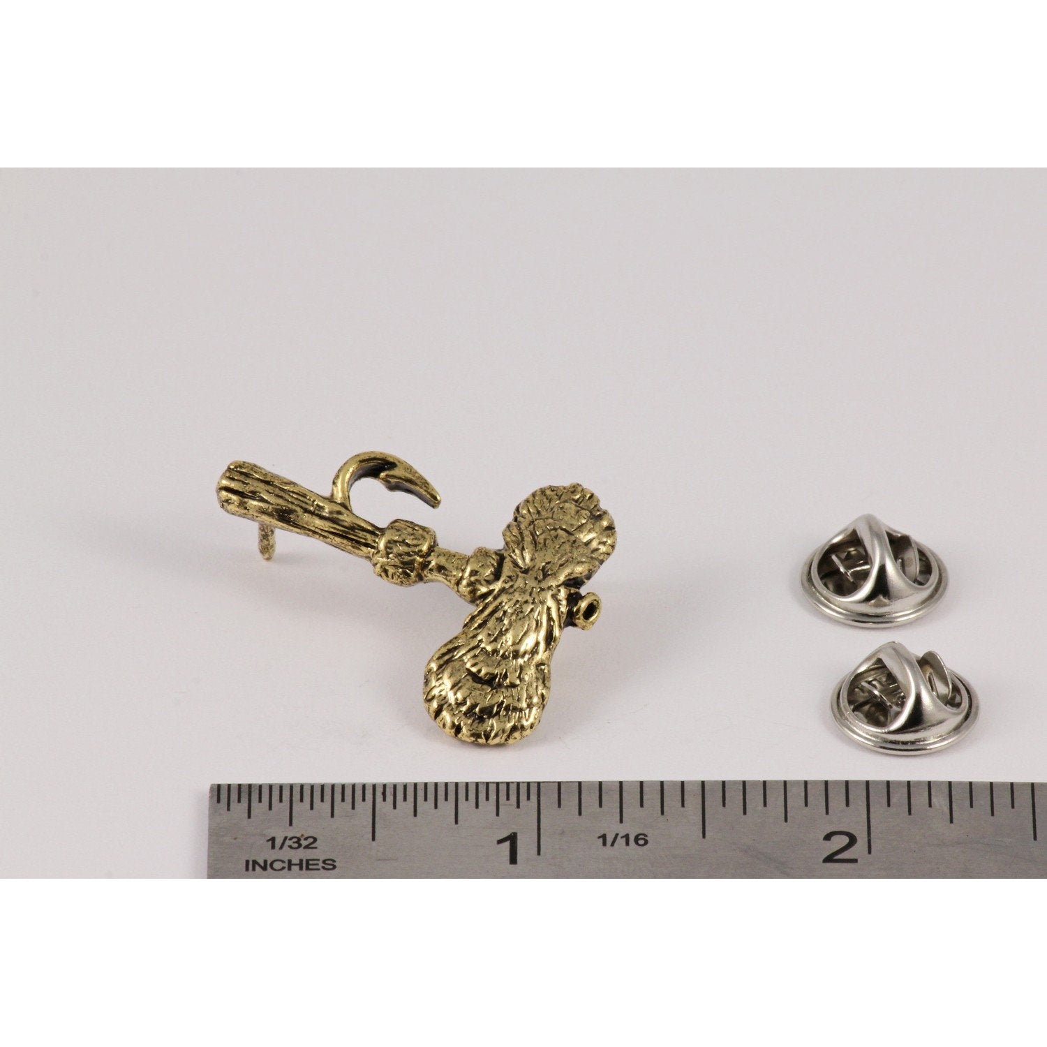 A handcrafted Royal Wulff Fly Pin next to a ruler, available for sale at Creativeartisan.com - the image offers a sense of scale