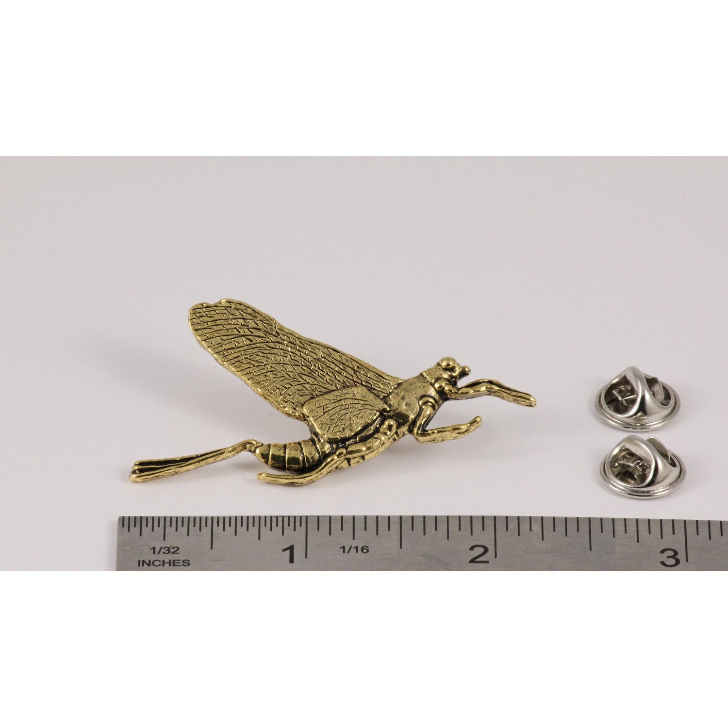 A handcrafted Mayfly Pin next to a ruler, available for sale at Creativeartisan.com - the image offers a sense of scale