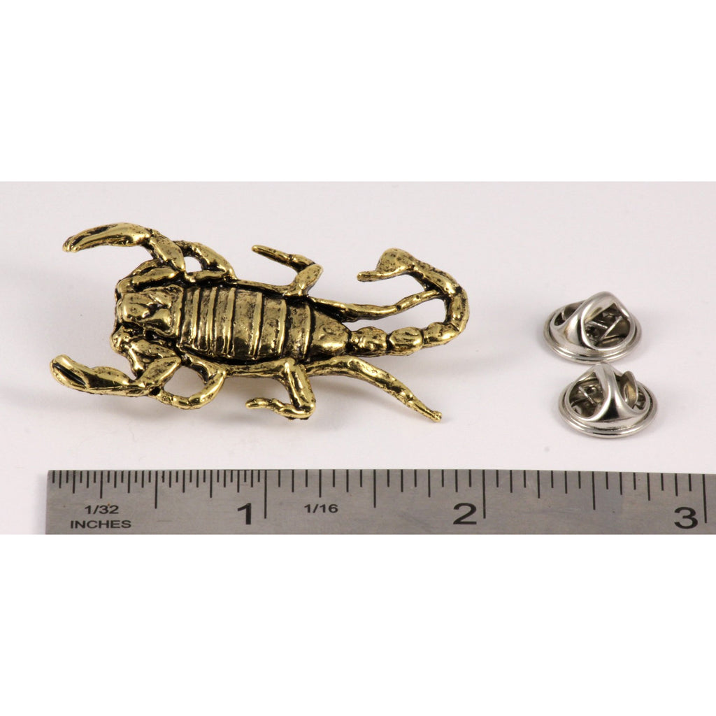 A handcrafted Scorpion Pin next to a ruler, available for sale at Creativeartisan.com - the image offers a sense of scale