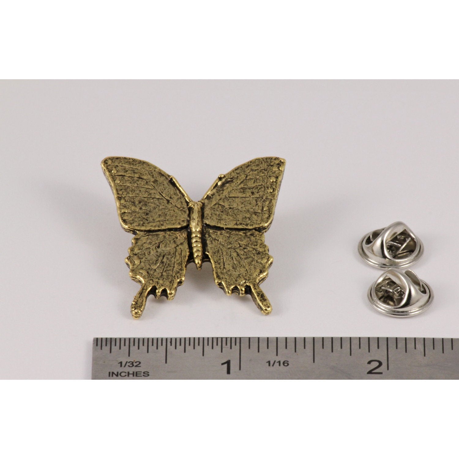 A handcrafted Tiger Swallowtail Butterfly Pin next to a ruler, available for sale at Creativeartisan.com - the image offers a sense of scale
