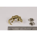 A handcrafted Gecko Pin next to a ruler, available for sale at Creativeartisan.com - the image offers a sense of scale