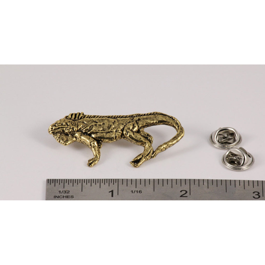 A handcrafted Iguana Pin next to a ruler, available for sale at Creativeartisan.com - the image offers a sense of scale