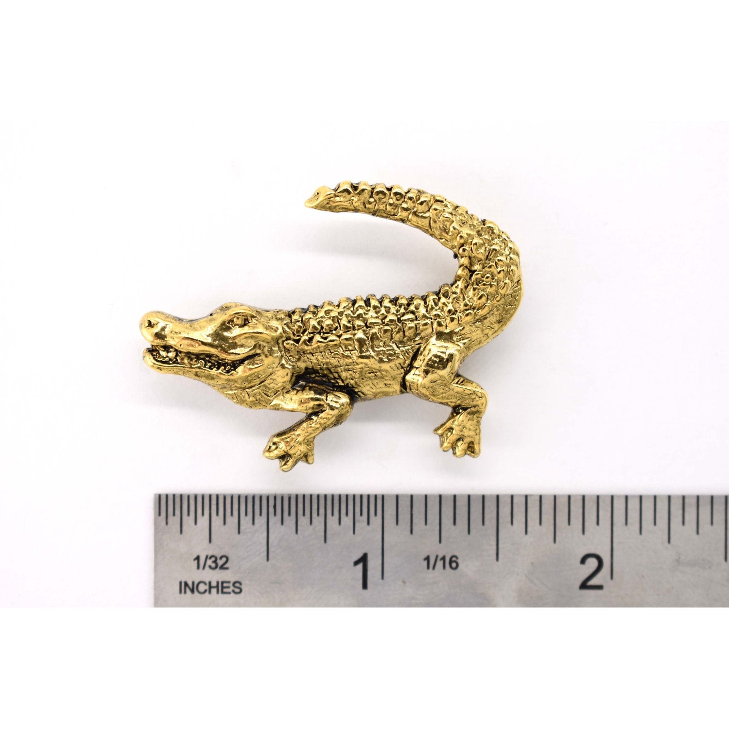 A handcrafted Alligator Crocodile Pin next to a ruler, available for sale at Creativeartisan.com - the image offers a sense of scale