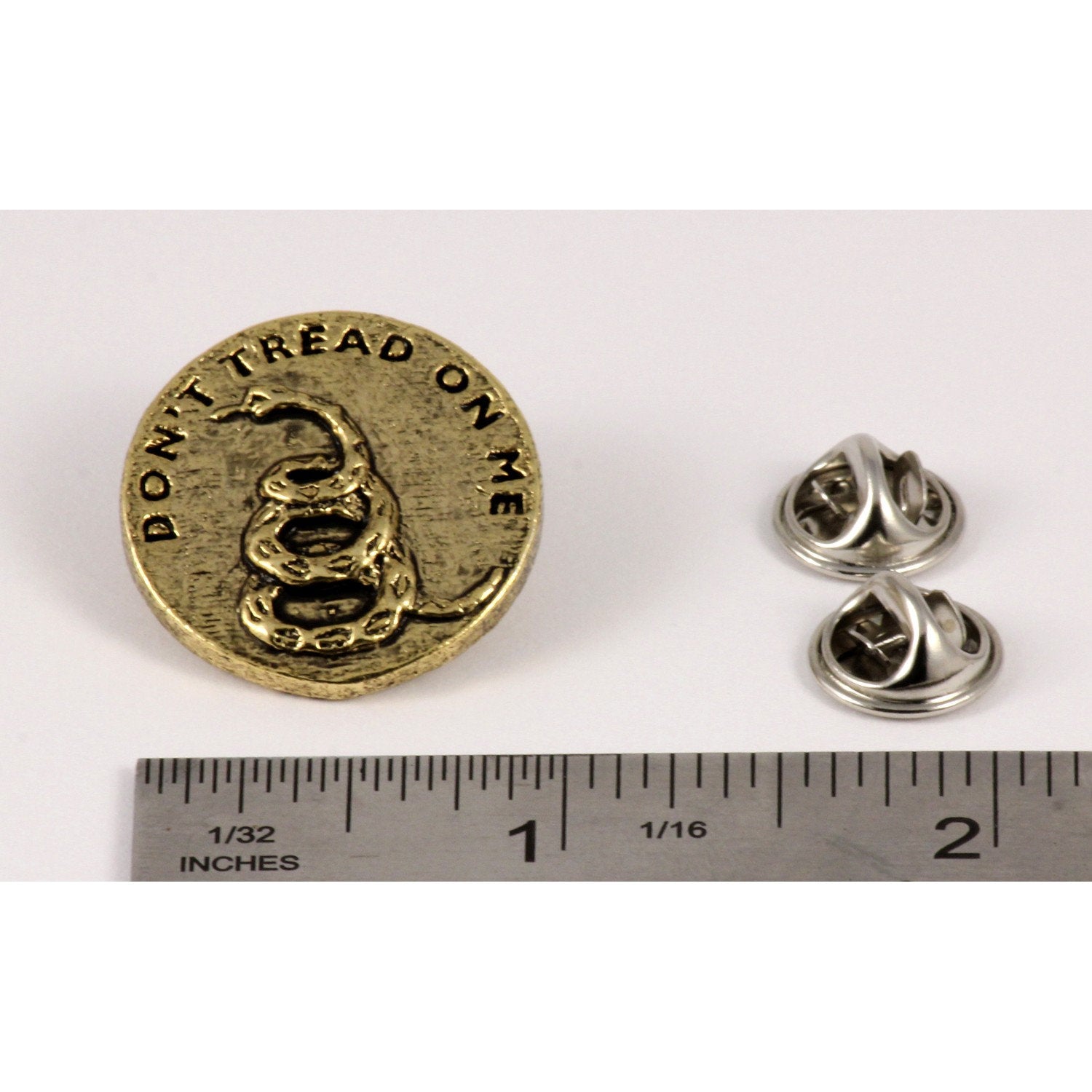 A handcrafted Dont Tread On Me Pin next to a ruler, available for sale at Creativeartisan.com - the image offers a sense of scale