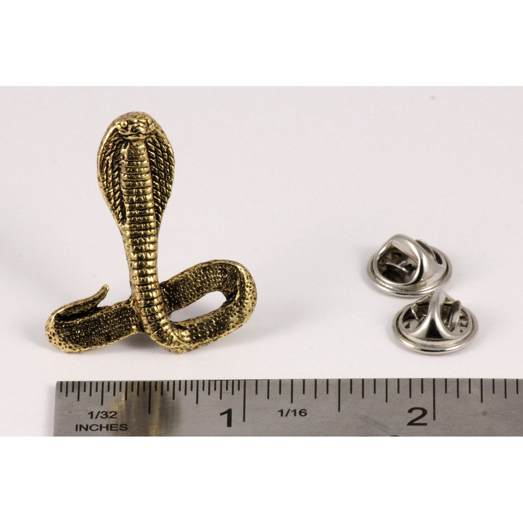 A handcrafted Cobra Pin next to a ruler, available for sale at Creativeartisan.com - the image offers a sense of scale
