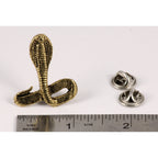 A handcrafted Cobra Pin next to a ruler, available for sale at Creativeartisan.com - the image offers a sense of scale