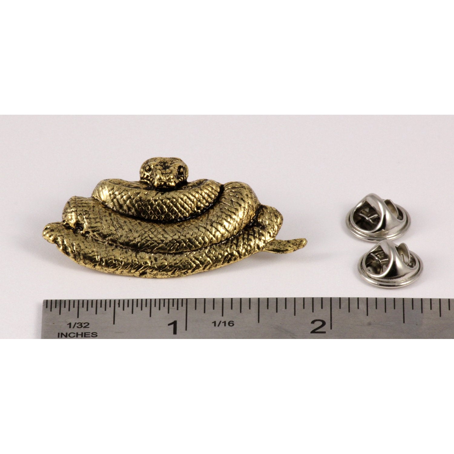 A handcrafted Python Pin next to a ruler, available for sale at Creativeartisan.com - the image offers a sense of scale