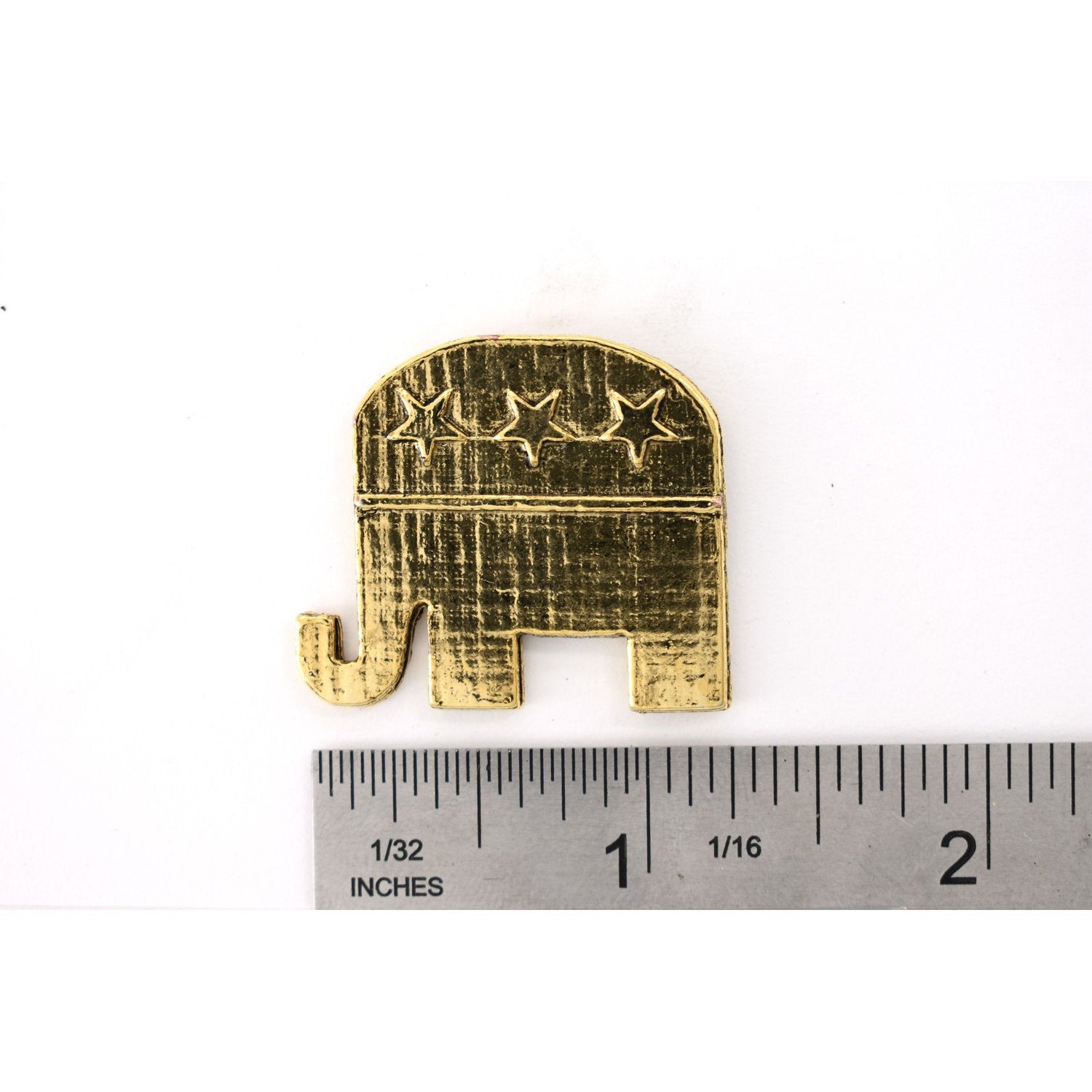 A handcrafted Republic Elephant Pin next to a ruler, available for sale at Creativeartisan.com - the image offers a sense of scale