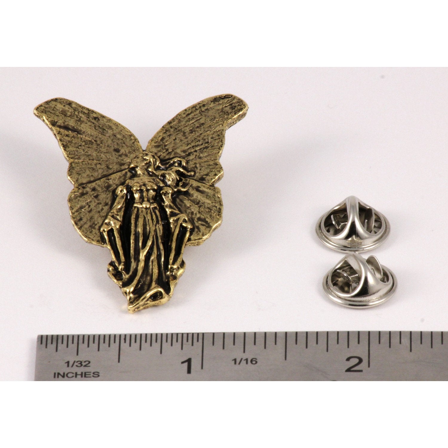 A handcrafted Angel Pin next to a ruler, available for sale at Creativeartisan.com - the image offers a sense of scale