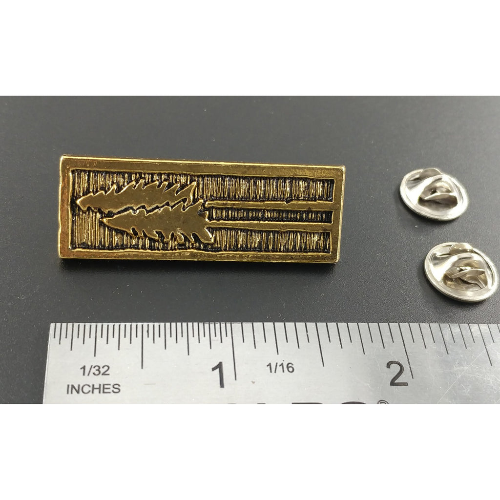 A handcrafted Tall Trees Pin next to a ruler, available for sale at Creativeartisan.com - the image offers a sense of scale