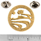 A handcrafted Palm Tree Pin next to a ruler, available for sale at Creativeartisan.com - the image offers a sense of scale