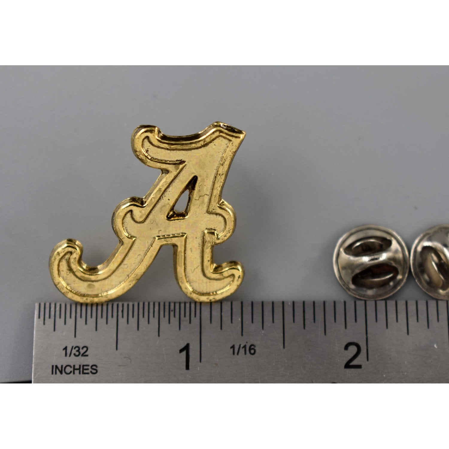 A handcrafted Fancy A Pin next to a ruler, available for sale at Creativeartisan.com - the image offers a sense of scale