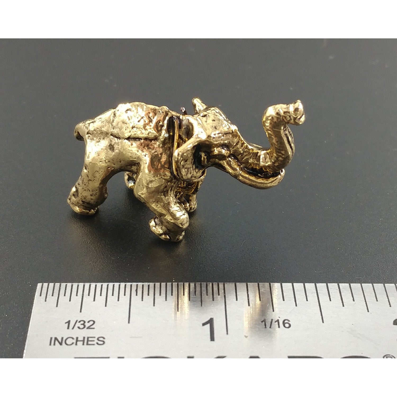 A handcrafted Elephant 3D Pin next to a ruler, available for sale at Creativeartisan.com - the image offers a sense of scale
