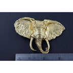 A handcrafted Elephant With Tusks Pin next to a ruler, available for sale at Creativeartisan.com - the image offers a sense of scale