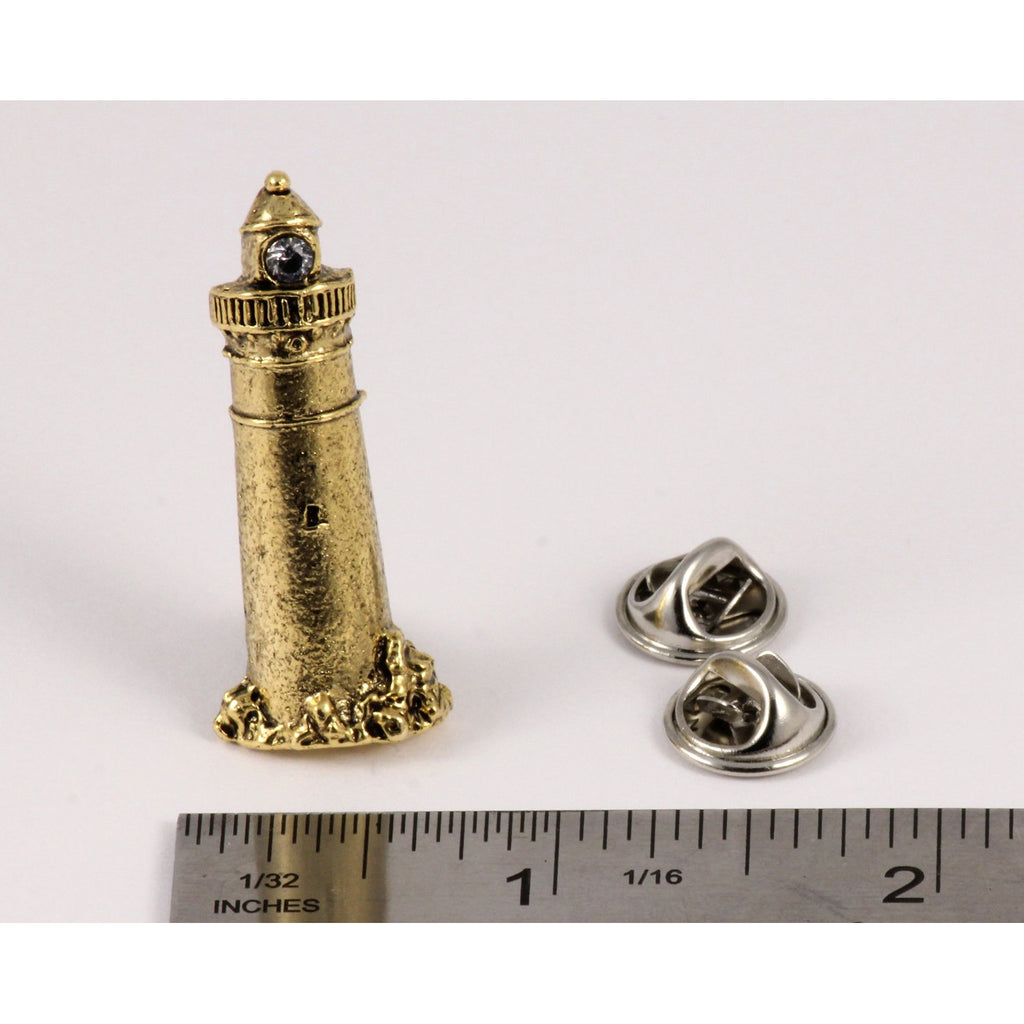 A handcrafted Lighthouse Pin next to a ruler, available for sale at Creativeartisan.com - the image offers a sense of scale