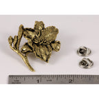 A handcrafted Day Lilly Pin next to a ruler, available for sale at Creativeartisan.com - the image offers a sense of scale
