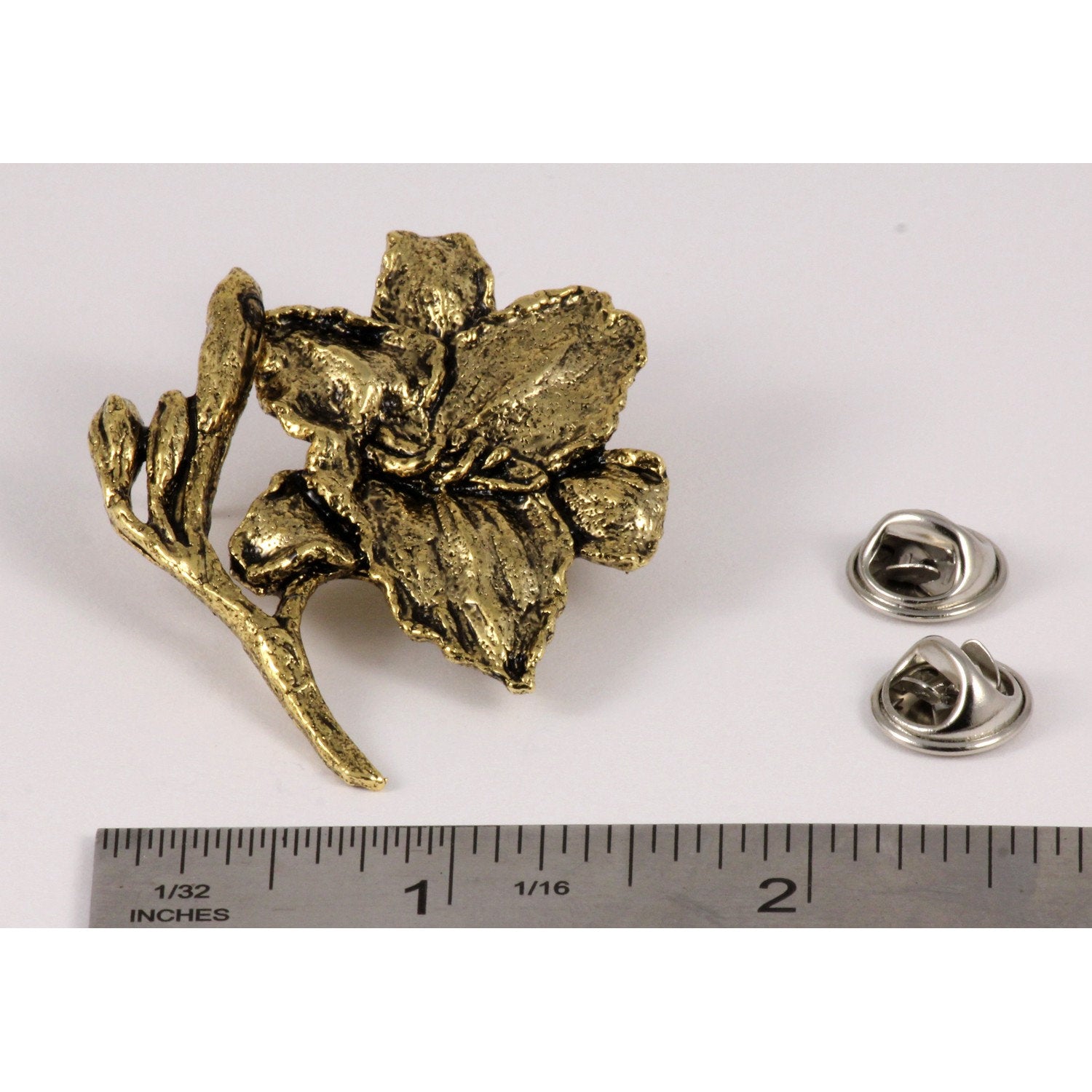 A handcrafted Day Lilly Pin next to a ruler, available for sale at Creativeartisan.com - the image offers a sense of scale