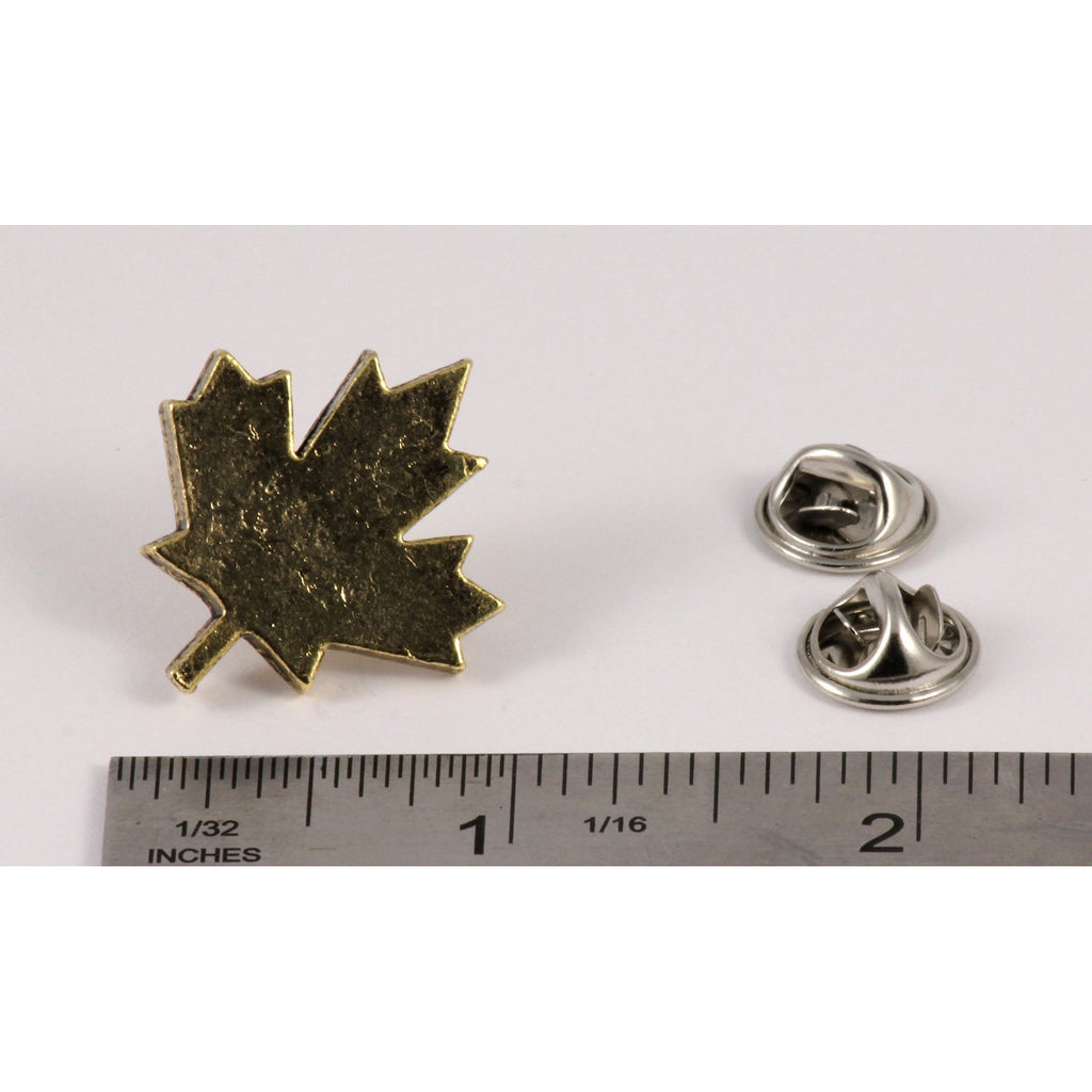 A handcrafted Canadian Maple Leaf Pin next to a ruler, available for sale at Creativeartisan.com - the image offers a sense of scale